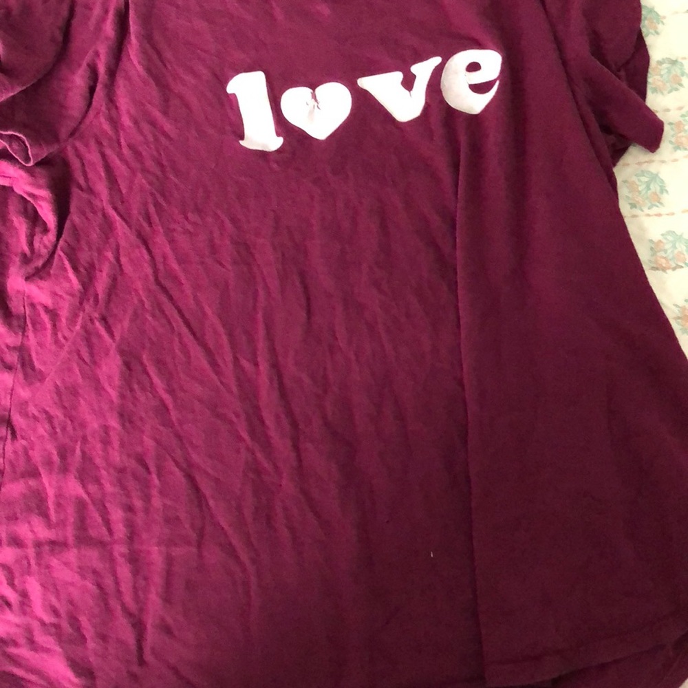 A maroon shorts sleeve shirt